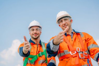 Professional engineer technician working outdoor at wind turbine field, Environmental engineer researching and developing clean energy sources, Green ecological power energy generation wind