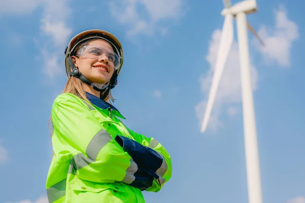 Professional engineer technician working outdoor at wind turbine field, Environmental engineer researching and developing clean energy sources, Green ecological power energy generation wind