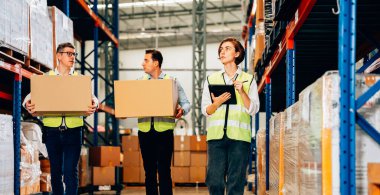 Warehouse supervisor using tablet for controlling and checking goods supplies on shelves with goods background in warehouse store, Logistic and business export concept