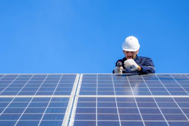 Solar panel station, Engineer worker installing solar panel at solar energy farm field, Alternative energy