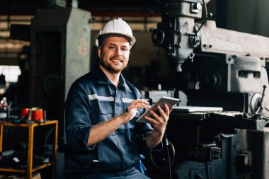Professional worker of manufacturing plant factory, Engineer working with machine, Maintenance machine, Mechanical engineering portrait