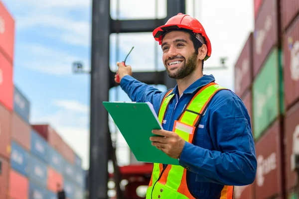 Warehouse engineer worker working at container yard. Logistics and transportation. High quality photo