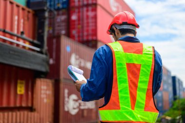 Warehouse engineer worker working at container yard. Logistics and transportation. High quality photo