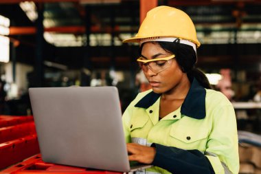 Technician engineer checking and repairing automatic robotic machine at industrial factory, Worker working at production line machine system in factory