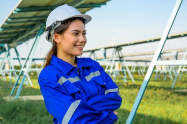 Engineer worker portrait with solar panel at solar farm, Solar farm with engineer workers analyzing solar cell, Renewable energy engineers work production of energy renewable or sustainable source