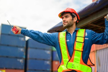 Warehouse engineer worker working at container yard. Logistics and transportation. High quality photo