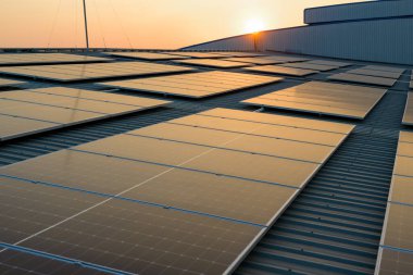 Solar cell farm power plant and solar panels with sunset in evening, Solar energy with warm sky, Clean energy, Alternative energy