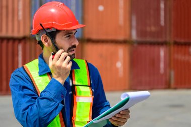 Warehouse engineer worker working at container yard. Logistics and transportation. High quality photo