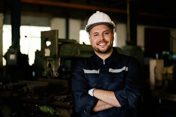 stock image Portrait of engineer worker with white helmet smiling to camera working at manufacturing area