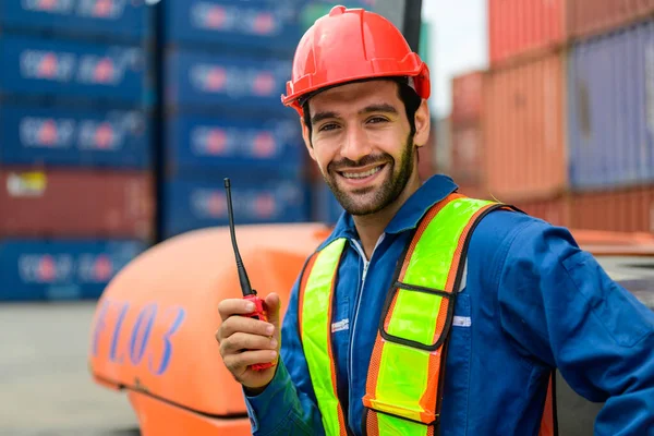 Warehouse engineer worker working at container yard. Logistics and transportation. High quality photo