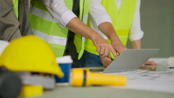 stock image Professional construction engineers team using blueprint of project plan brainstorming and working together at construction building, Architecture and building construction concept