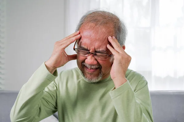 stock image Senior Headache, Elderly with Dizzy, Elderly upset with headache, Senior constipation hand touch head. Senior man feeling suffer from terrible headache, Elderly have Migraine symptom