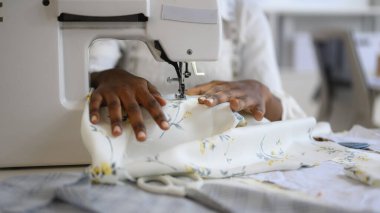 Happy female dressmaker working in workshop, Female tailor fashion designer checking measurements and fitting of dress, Tailoring clothing on mannequin garment workshop studio, Small business owner