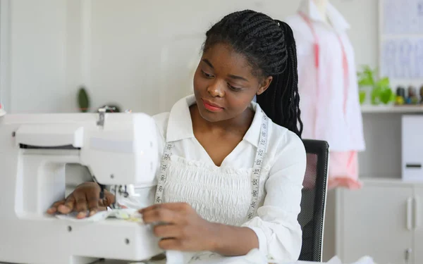 Happy female dressmaker working in workshop, Female tailor fashion designer checking measurements and fitting of dress, Tailoring clothing on mannequin garment workshop studio, Small business owner