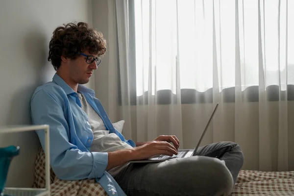 Man using laptop working at home, Happy businessman using laptop sending email working at home, Freelancer typing on computer laptop with paperworks and documents