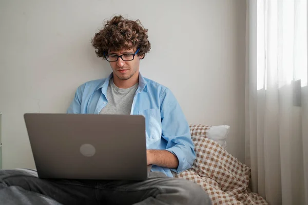 Man using laptop working at home, Happy businessman using laptop sending email working at home, Freelancer typing on computer laptop with paperworks and documents