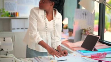 Happy female dressmaker working in workshop, Female tailor fashion designer checking measurements and fitting of dress, Tailoring clothing on mannequin garment workshop studio, Small business owner