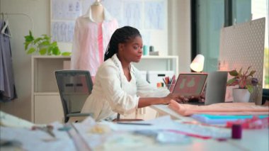 Happy female dressmaker working in workshop, Female tailor fashion designer checking measurements and fitting of dress, Tailoring clothing on mannequin garment workshop studio, Small business owner