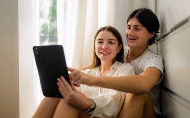 Couple of romantic young people spending time together on weekend at home, Boyfriend and girlfriend portrait, Vintage style photo