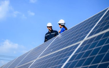 Solar panel station, Engineer worker installing solar panel at solar energy farm field, Alternative energy