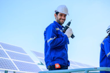 Solar panel station, Engineer worker installing solar panel at solar energy farm field, Alternative energy