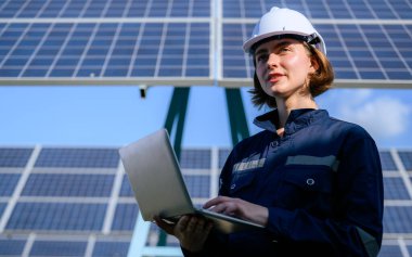 Engineer worker portrait with solar panel at solar farm, Solar farm with engineer workers analyzing solar cell, Renewable energy engineers work production of energy renewable or sustainable source