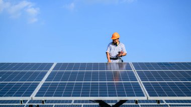 Solar panel station, Engineer worker installing solar panel at solar energy farm field, Alternative energy