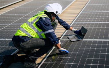 Professional engineer technician with safety helmet checking system. High quality photo