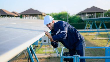 Solar panel station, Engineer worker installing solar panel at solar energy farm field, Alternative energy
