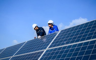 Solar panel station, Engineer worker installing solar panel at solar energy farm field, Alternative energy