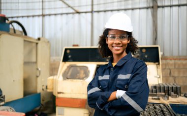 Smiling portrait of confident engineer worker at factory, People with happy working