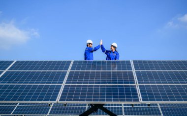 Solar panel station, Engineer worker installing solar panel at solar energy farm field, Alternative energy