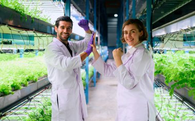 Smart farm with technology, People with indoor farm factory, Researchers developing vegetable varieties at greenhouse agriculture