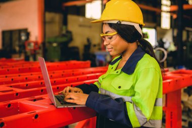 Technician engineer checking and repairing automatic robotic machine at industrial factory, Worker working at production line machine system in factory