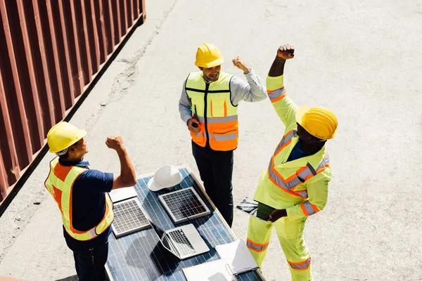 Group of teamwork warehouse worker working at cargo containers shipping, Professional foreman working at container cargo site, Warehouse engineer worker checking and working at industrial container
