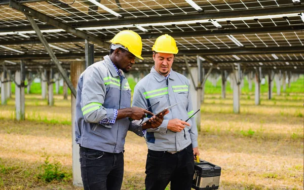 Maintenance engineer checking and maintaining solar panels on solar cell farm, Technician working on ecological solar farm, People with clean energy technology, Renewable energy, Solar power plant