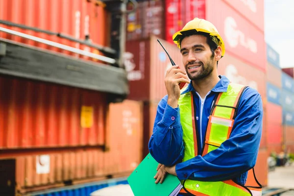Industrial engineer worker with co-worker team working at overseas shipping container yard, Logistics supply chain management, International good import and export