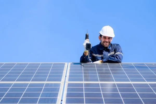 Technician worker installing solar panels at solar cell farm, Engineer working at power station, Electric system maintenance at solar panels field, Eco friendly and clean energy