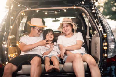 Happy Asian family travel together on beach on holiday. Family with beach travel. People enjoying with holiday vacation. High quality photo