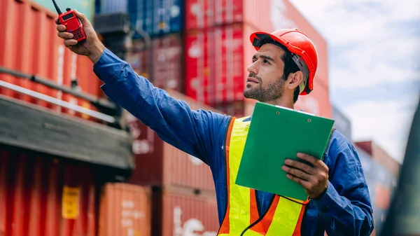 Warehouse engineer worker working at industrial container yard, Logistics and transportation, Import and export business, High quality photo