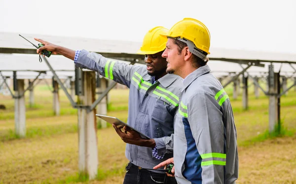 Maintenance engineer checking and maintaining solar panels on solar cell farm, Technician working on ecological solar farm, People with clean energy technology, Renewable energy, Solar power plant