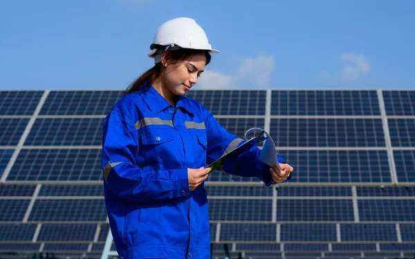 Engineer worker portrait with solar panels at solar farm, Solar farm with engineer, Worker analyzing solar cell, Renewable energy, Production of energy renewable and sustainable source