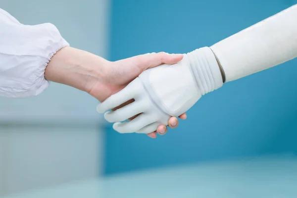 stock image Professional technician checking and controlling artificial prosthetic hand working in laboratory, Development engineer specialist with high tech technology at prosthetic manufacturing, Interaction of