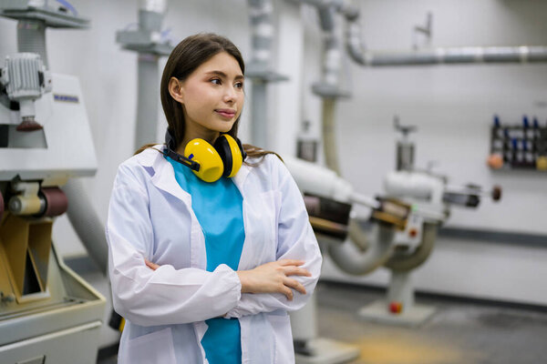 Portrait of young prosthetic technician working at prosthetic manufacturing, Development engineer specialist with high tech technology at prosthetic manufacturing, New artificial limb production for