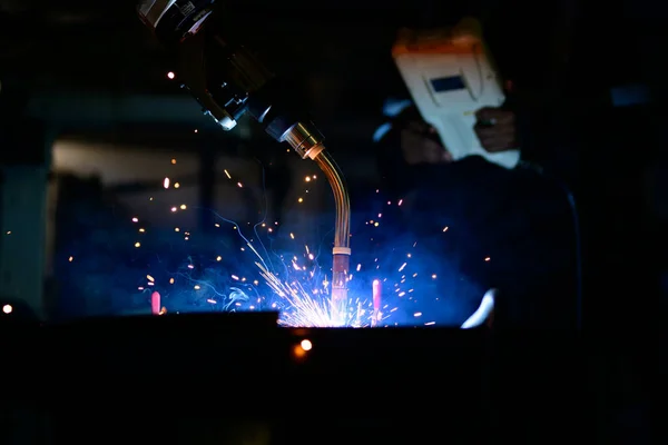 Stock image Metal welder specialist working with arc welding machine, Metalwork manufacturing