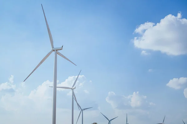 stock image Windmill park with clouds and a blue sky, Wind turbine field, Green ecological power energy generation wind sustainable energy concept