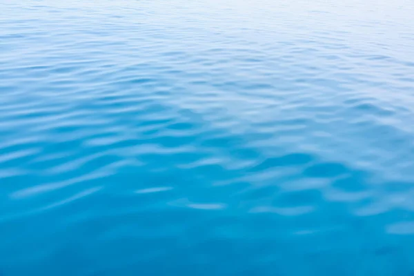 stock image Blue sea with gentle waves and a sky of the same color as the sea, a peaceful ocean with small waves that are pleasing to the eye