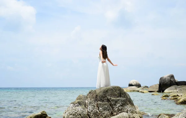 stock image Happy traveler woman with white dress enjoying with beautiful view on beach, Woman travel on Koh Tao Islands in Thailand, Famous tourist attractions, Popular tourist destinations, Summer travel