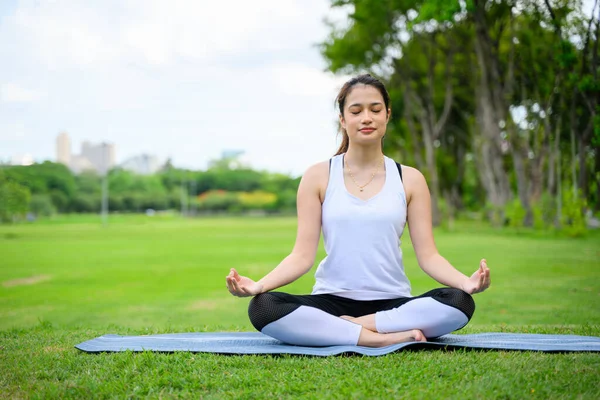 stock image life style of young woman practice yoga at park. out door Yoga at park. High quality photo