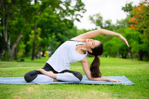 stock image life style of young woman practice yoga at park. out door Yoga at park. High quality photo